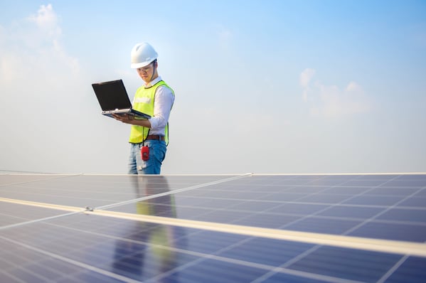 solar engineer running a check